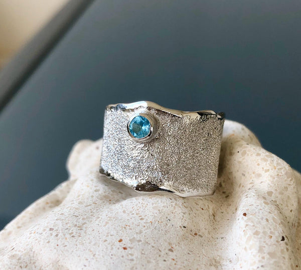 wide silver ring with blue gemstone, blue topaz ring 