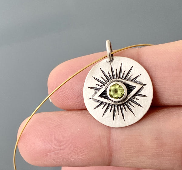 Evil eye necklace silver with a green gemstone 