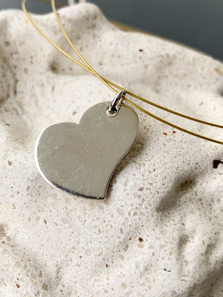 silver heart necklace on a wire 
