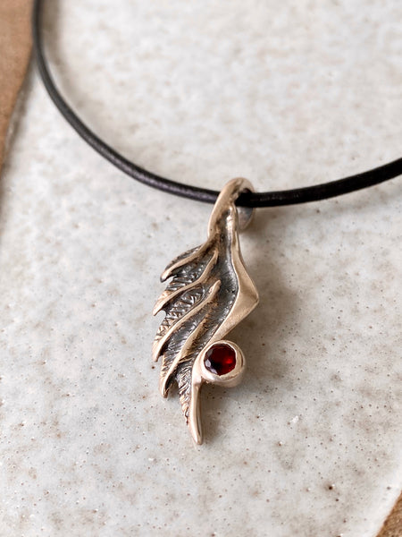 Angel wing necklace with red garnet gemstone 