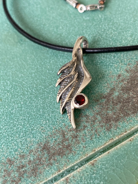 Angel wing necklace with red garnet gemstone 