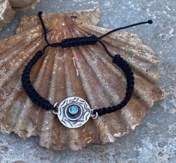 Silver evil eye bracelet with a blue gemstone