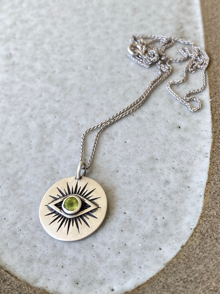 Evil eye necklace silver with a green gemstone 