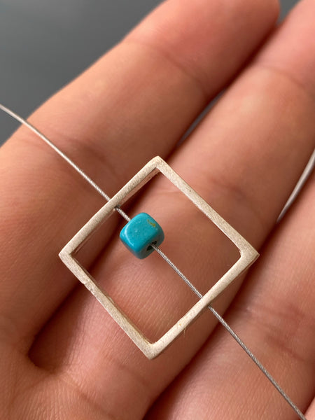 Silver square necklace with turquoise on a stainless steel wire