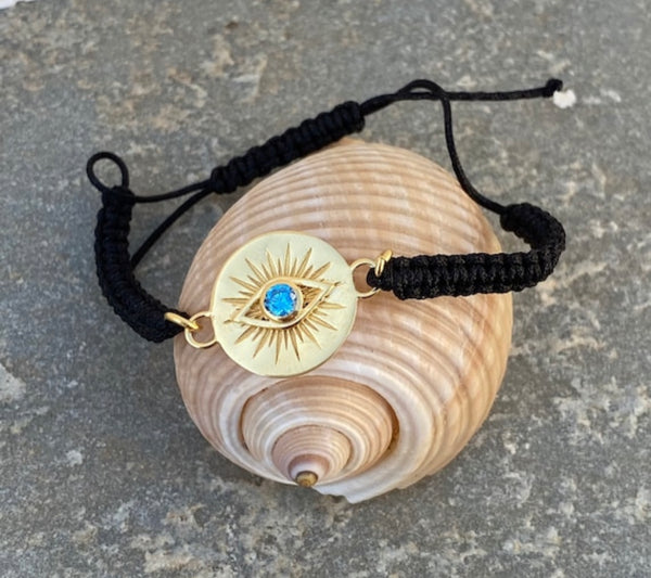 Evil eye bracelet gold with blue gem,  macrame