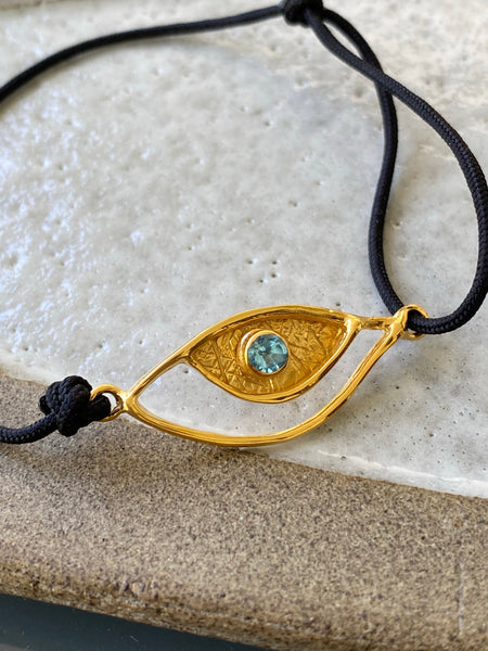 Evil eye bracelet gold, blue topaz gemstone black nylon cord 