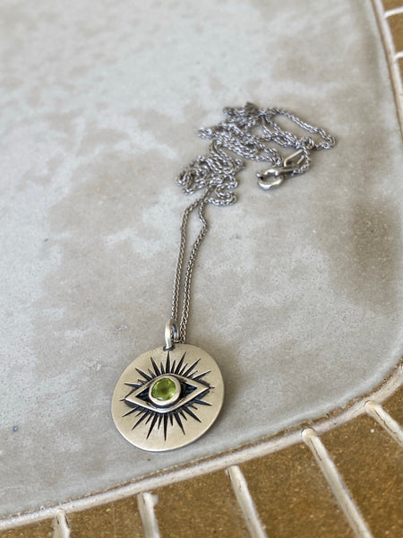 Evil eye necklace silver with a green gemstone 