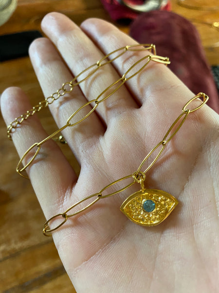 Gold evil eye pendant with blue gemstone long paper clip chain