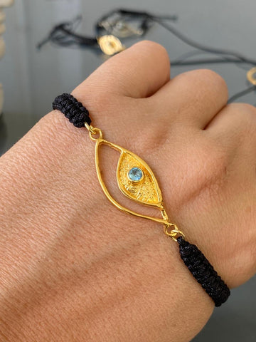 Evil eye bracelet gold, blue topaz gemstone black nylon cord