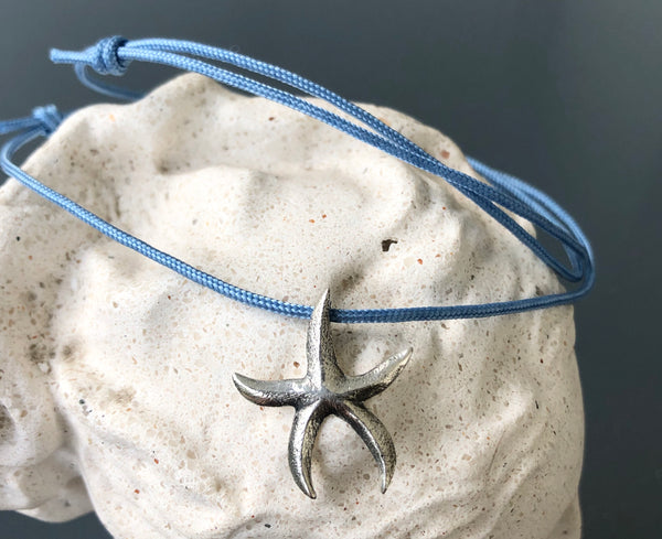 Starfish pendant sterling silver with blue cord 