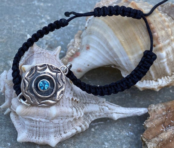 Silver evil eye bracelet with a blue gemstone