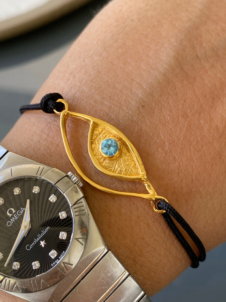 Evil eye bracelet gold, blue topaz gemstone black nylon cord 