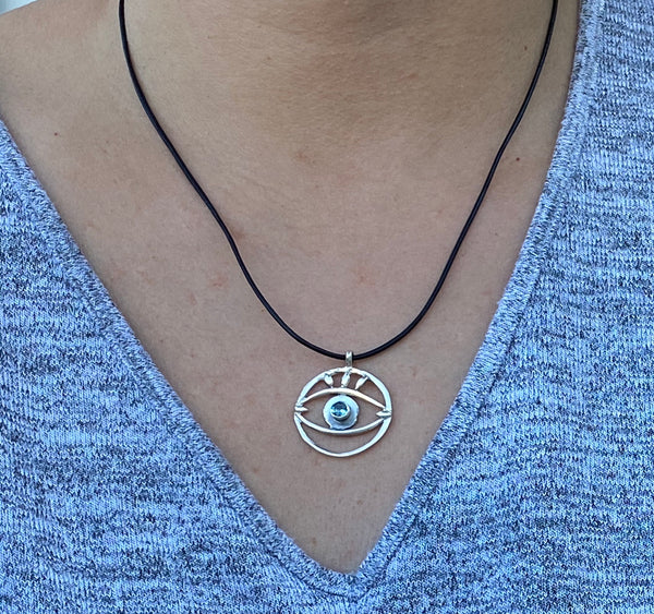 Evil eye necklace with blue gemstone and leather cord