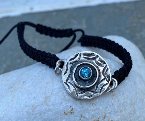 Silver evil eye bracelet with a blue gemstone
