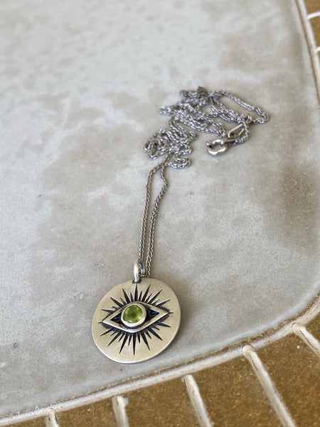 Evil eye necklace silver with a green gemstone 