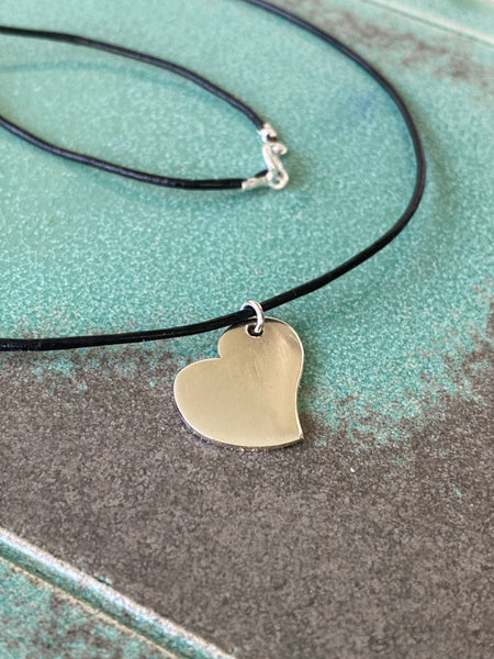 silver heart necklace with leather cord 