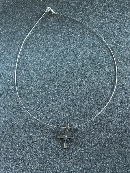 small black cross, woman’s silver cross 